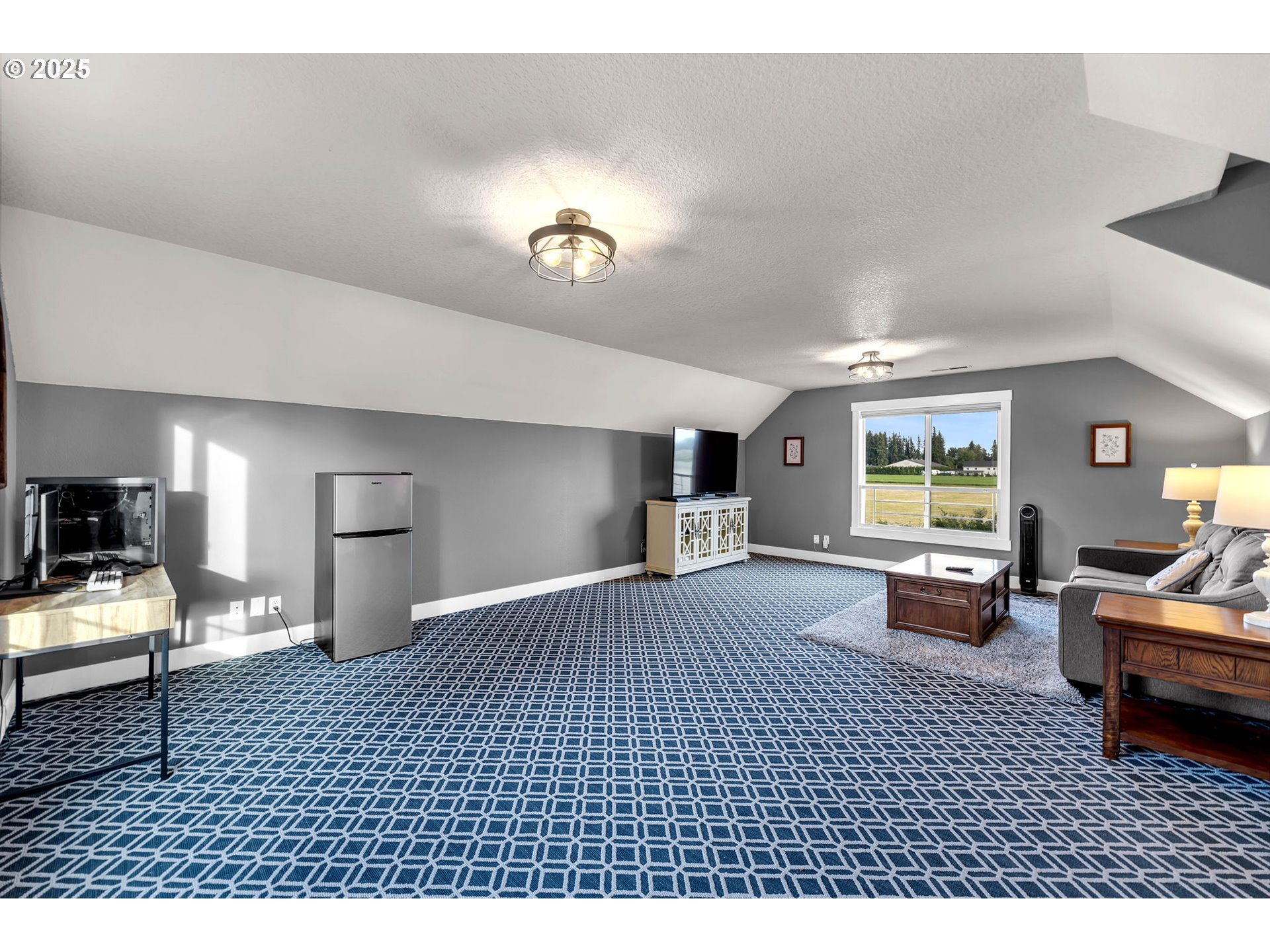 8805 Northeast 179th Street Battle Ground, WA 98604 - Photo 25 of 48 a bedroom with furniture and a wooden floor