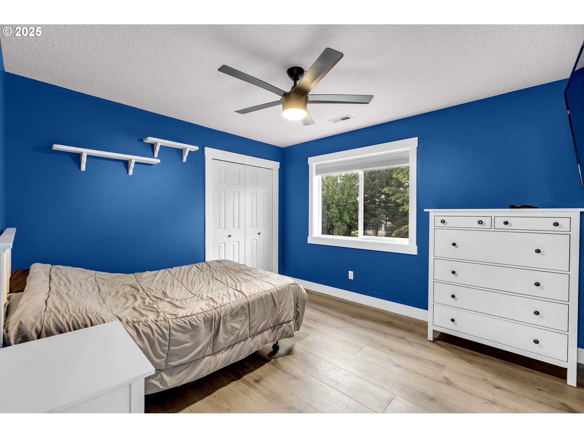 8805 Northeast 179th Street Battle Ground, WA 98604 - Photo 32 of 48 a bedroom with a bed and window