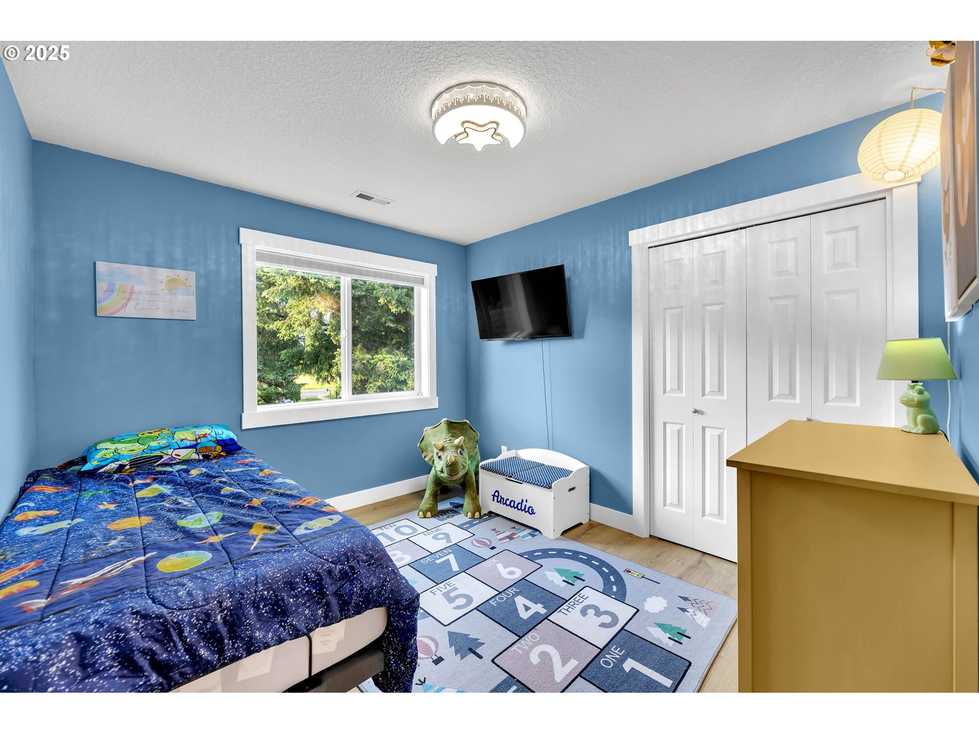 8805 Northeast 179th Street Battle Ground, WA 98604 - Photo 36 of 48 a bedroom with a bed and wooden floor