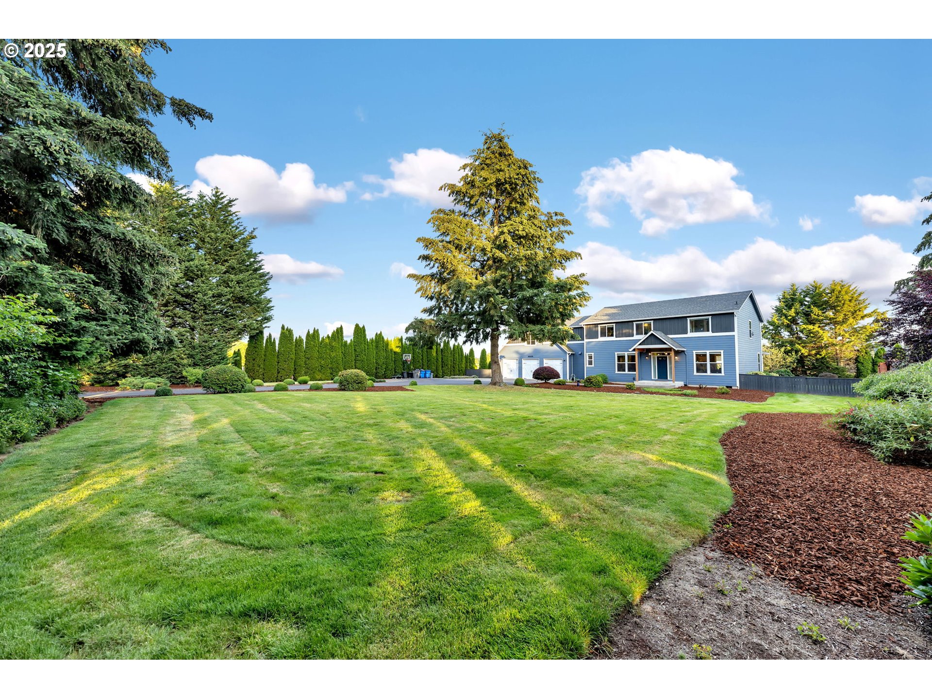 8805 Northeast 179th Street Battle Ground, WA 98604 - Photo 38 of 48 a view of a yard with a house in the background