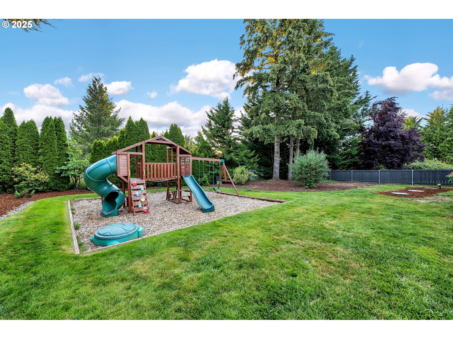 8805 Northeast 179th Street Battle Ground, WA 98604 - Photo 40 of 48 a view of a garden with a slide