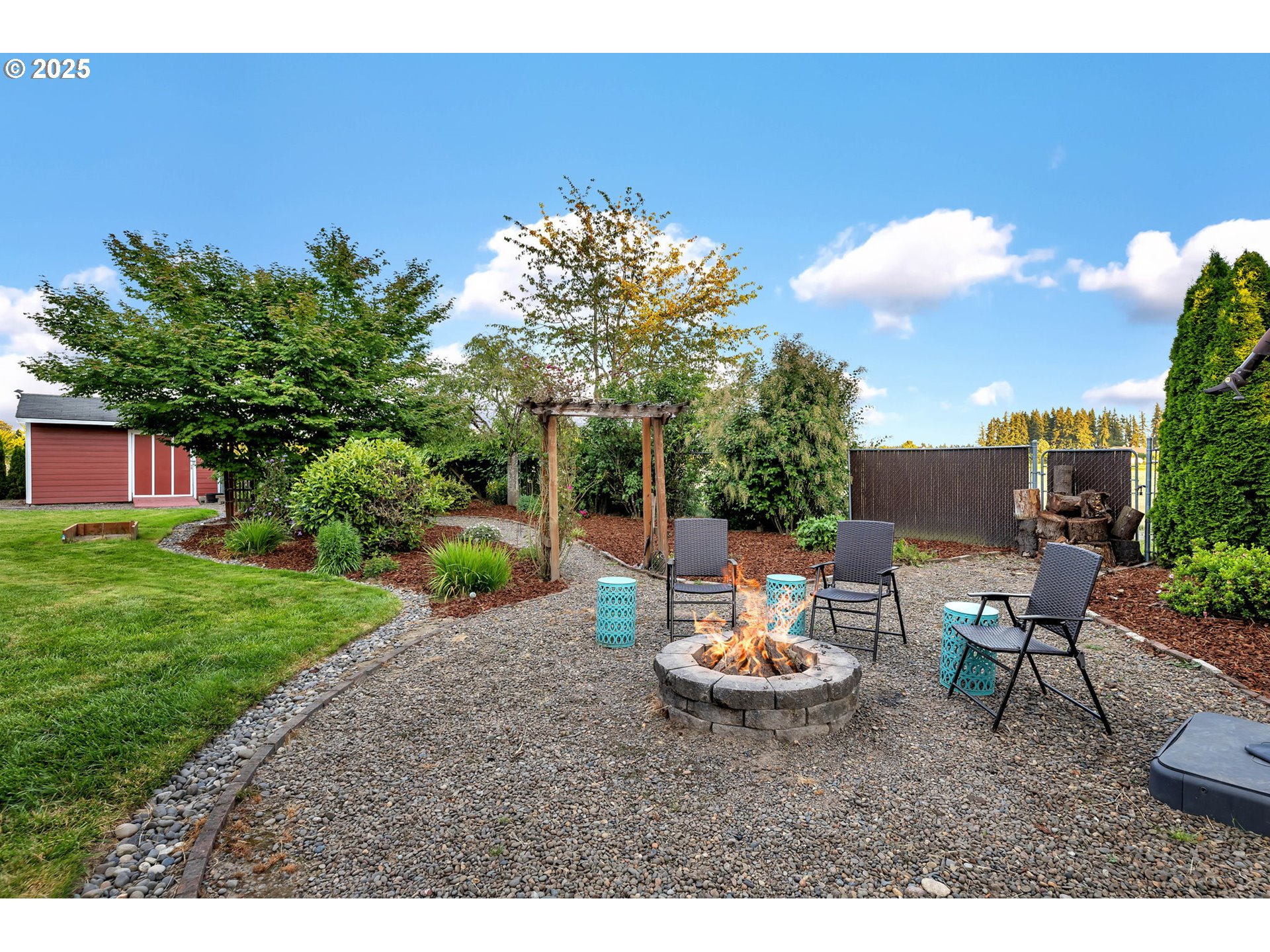 8805 Northeast 179th Street Battle Ground, WA 98604 - Photo 43 of 48 a view of a backyard with plants and a patio