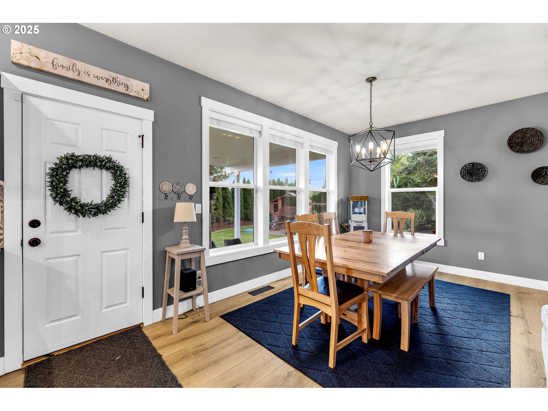8805 Northeast 179th Street Battle Ground, WA 98604 - Photo 8 of 48 a view of a dining room with furniture wooden floor and chandelier