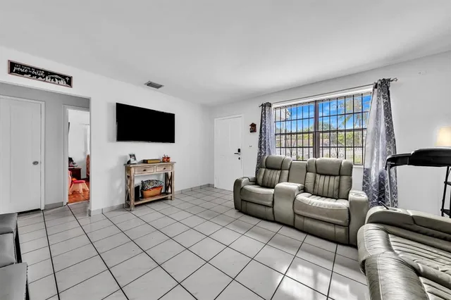 a bed room with a bed and a television