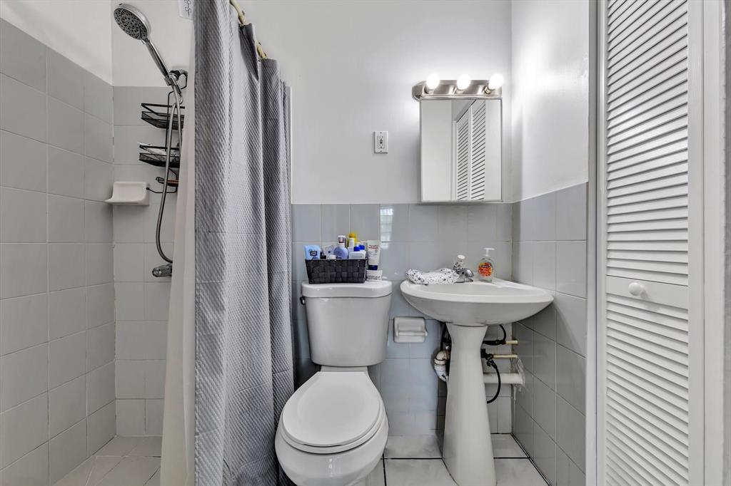 9311 Broad Manor Road Miami, FL 33147 - Photo 24 of 32 a bathroom with a sink toilet and shower