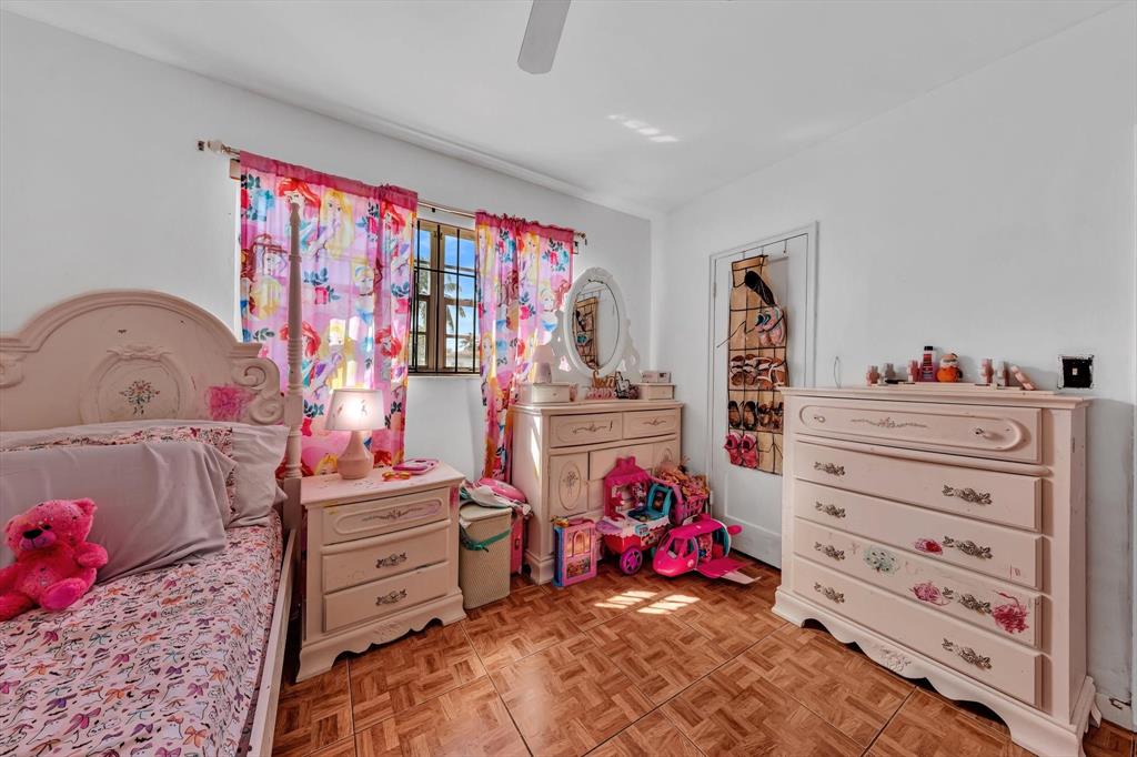 9311 Broad Manor Road Miami, FL 33147 - Photo 31 of 32 a bedroom with a bed and a window