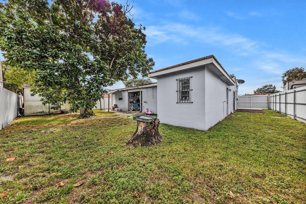 9311 Broad Manor Road Miami, FL 33147 - Photo 4 of 32 a house view with a garden space