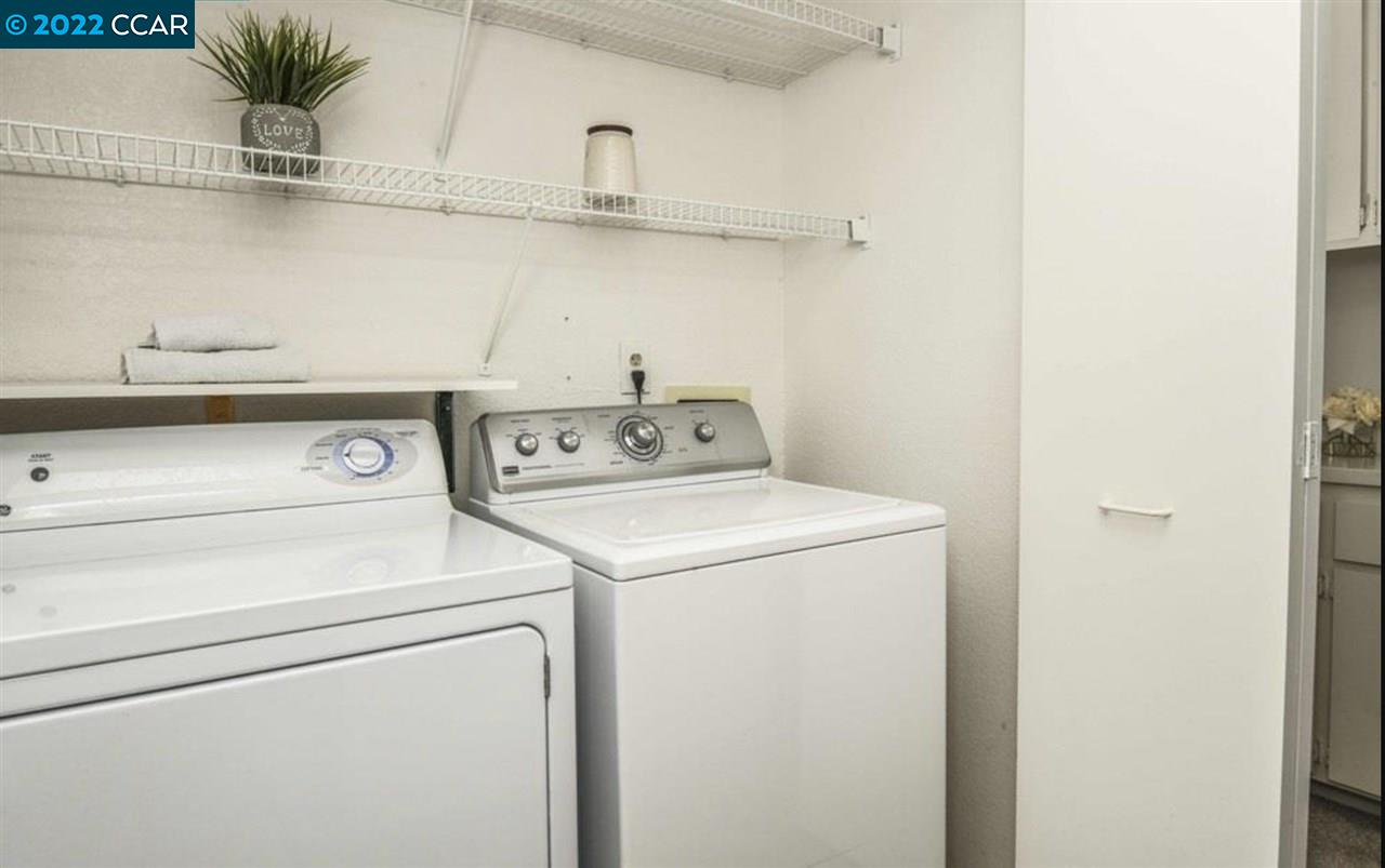 7650 Canyon Meadows Circle, Unit G Pleasanton, CA 94588 - Photo 14 of 24 a utility room with dryer and washer