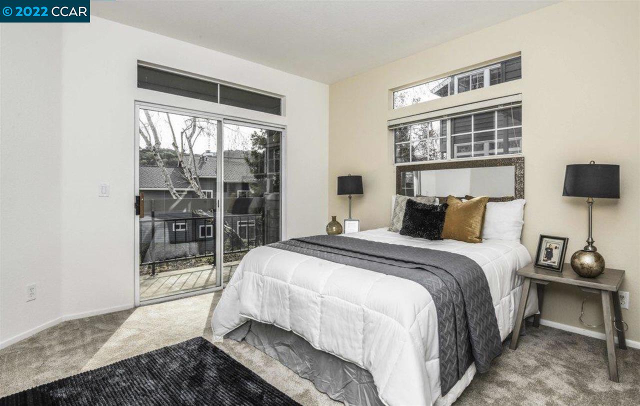 7650 Canyon Meadows Circle, Unit G Pleasanton, CA 94588 - Photo 15 of 24 a bedroom with a bed and wooden floor