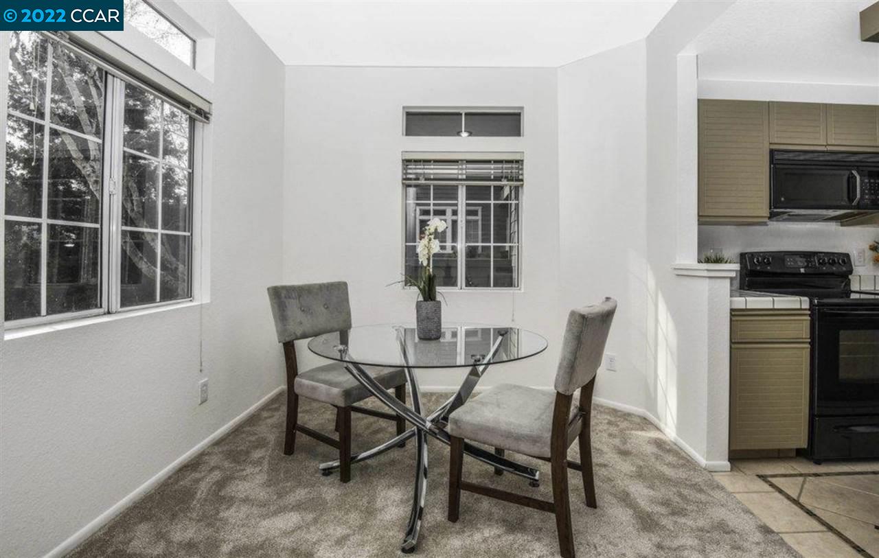 7650 Canyon Meadows Circle, Unit G Pleasanton, CA 94588 - Photo 10 of 24 a dining room with furniture and window