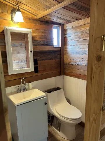 a kitchen with counter top space and wooden floor