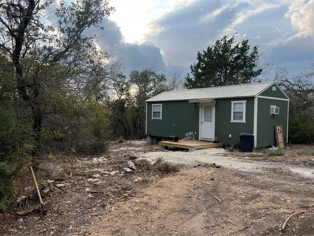a view of a house with backyard space