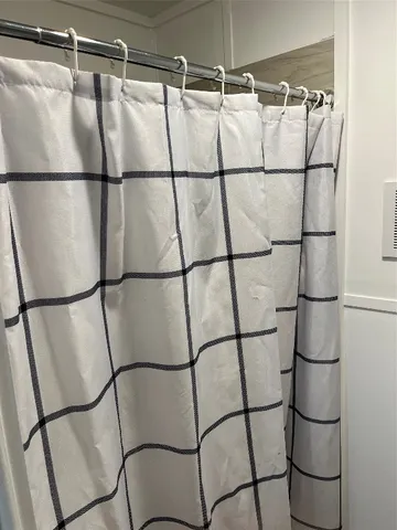 a en suite bathroom with a granite countertop sink and a mirror