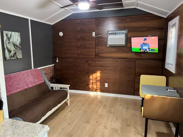 a bedroom with a bed and a stove