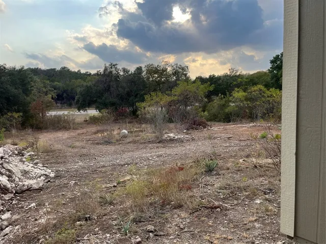 a view of lake with green space