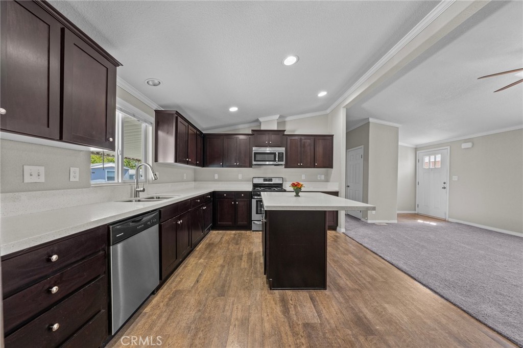 3909 Reche Road, Unit 194 Fallbrook, CA 92028 - Photo 17 of 37 a large kitchen with stainless steel appliances granite countertop a large counter top and a stove