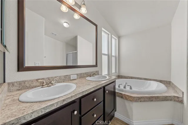 a bath tub sitting in a bathroom next to a window