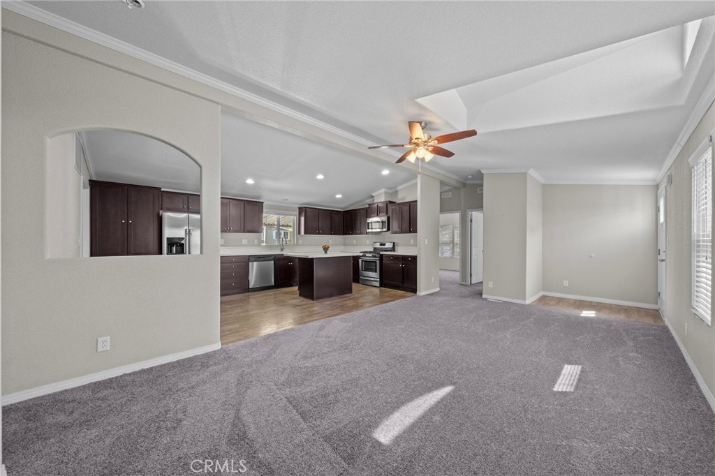3909 Reche Road, Unit 194 Fallbrook, CA 92028 - Photo 3 of 37 a view of a kitchen with a sink and a refrigerator