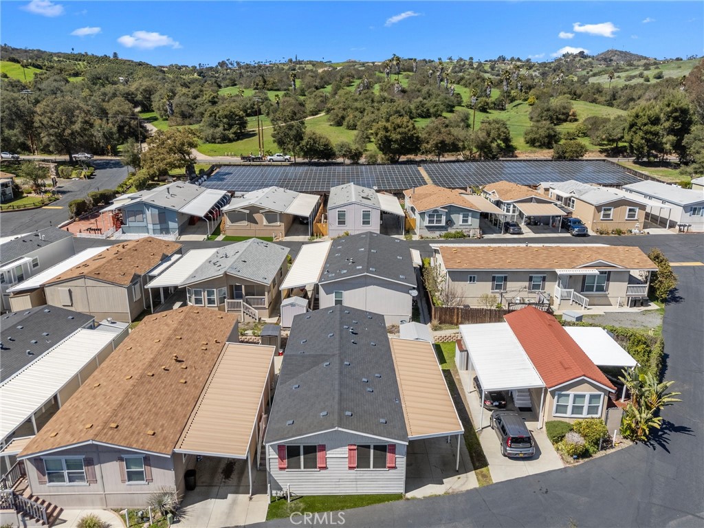 3909 Reche Road, Unit 194 Fallbrook, CA 92028 - Photo 8 of 37 an aerial view of residential houses with outdoor space and street view