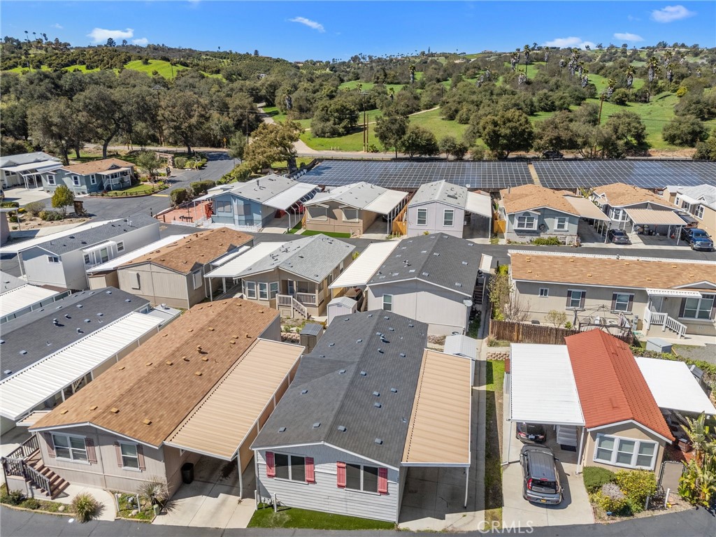 3909 Reche Road, Unit 194 Fallbrook, CA 92028 - Photo 9 of 37 an aerial view of residential houses with outdoor space and parking