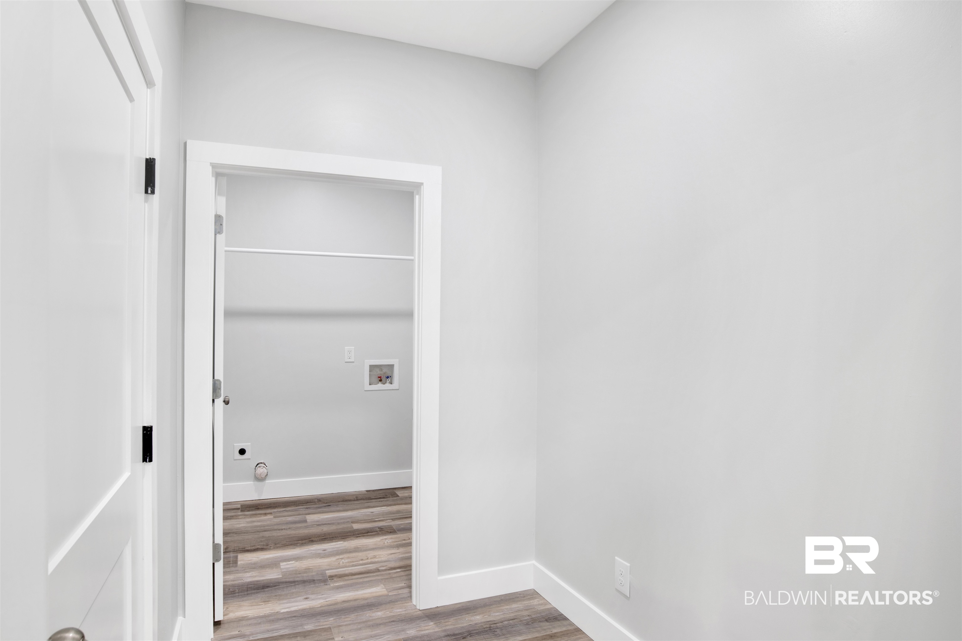 30604 Orange Street Elberta, AL 36530 - Photo 11 of 27 Corridor featuring wood-type flooring