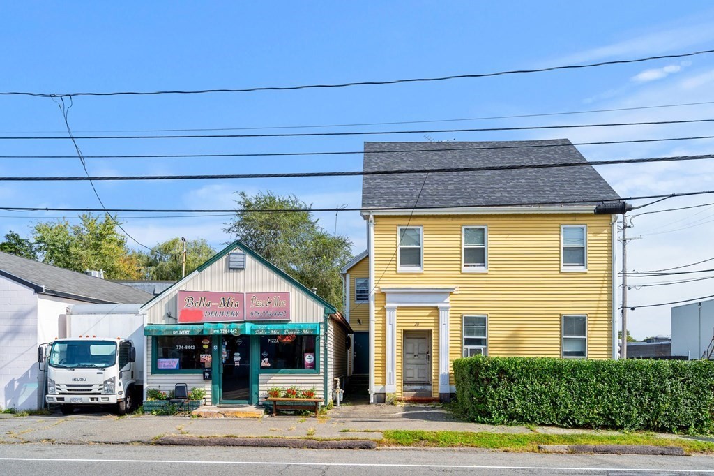 a view of building with cars parked