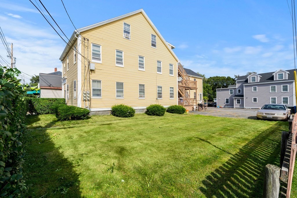 20 Water Street Danvers, MA 01923 - Photo 11 of 33 a view of a house with a yard