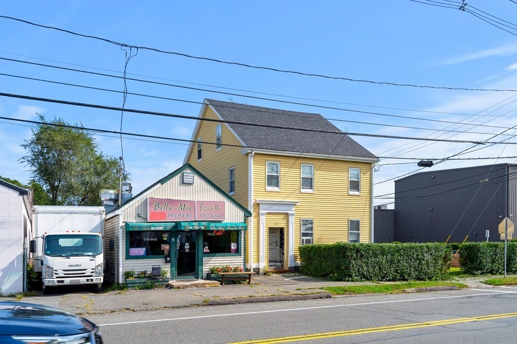 20 Water Street Danvers, MA 01923 - Photo 2 of 33 a front view of a building with car parked