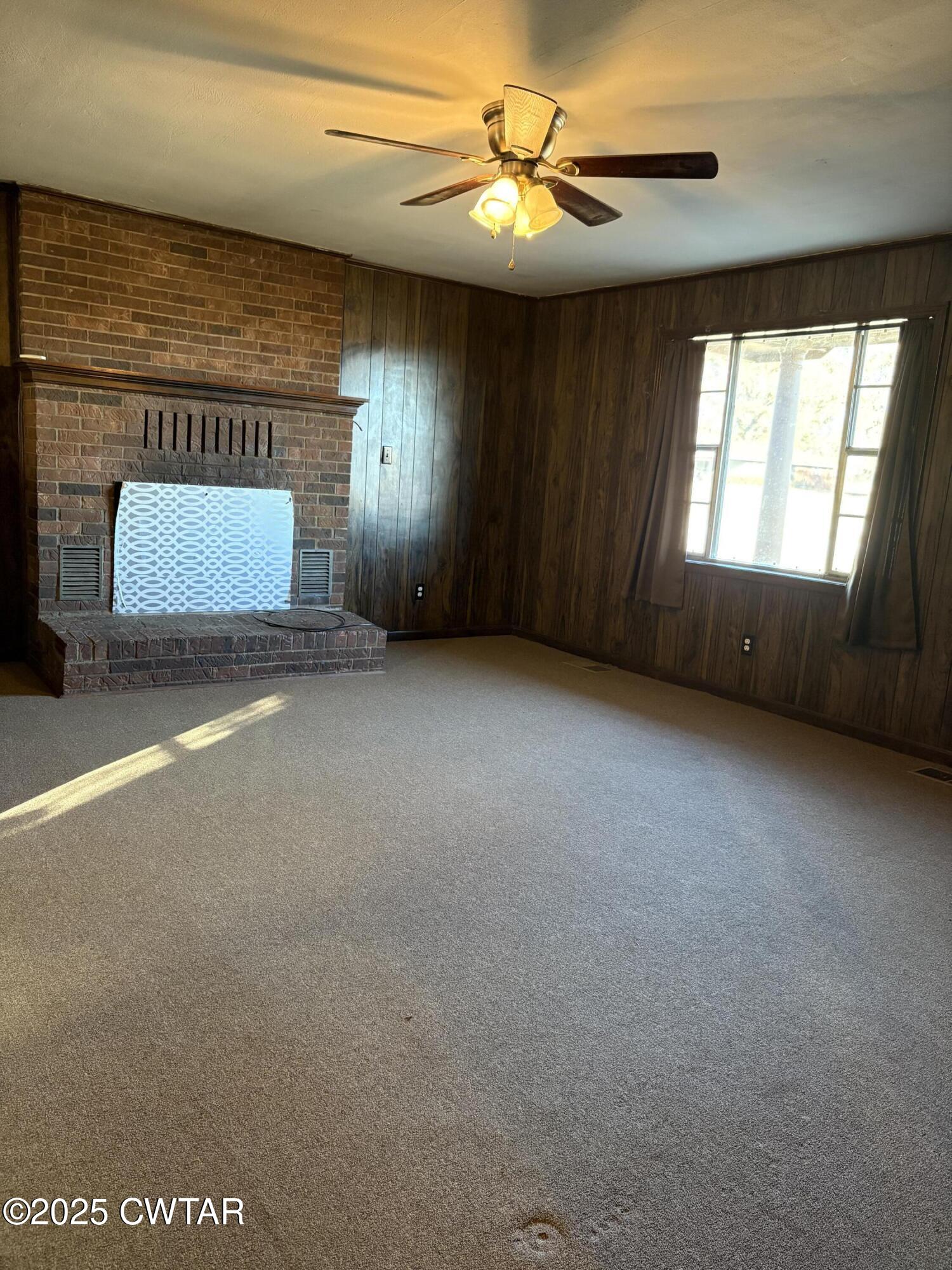 115 Jaynes Road Bells, TN 38006 - Photo 11 of 19 a view of an empty room with a window