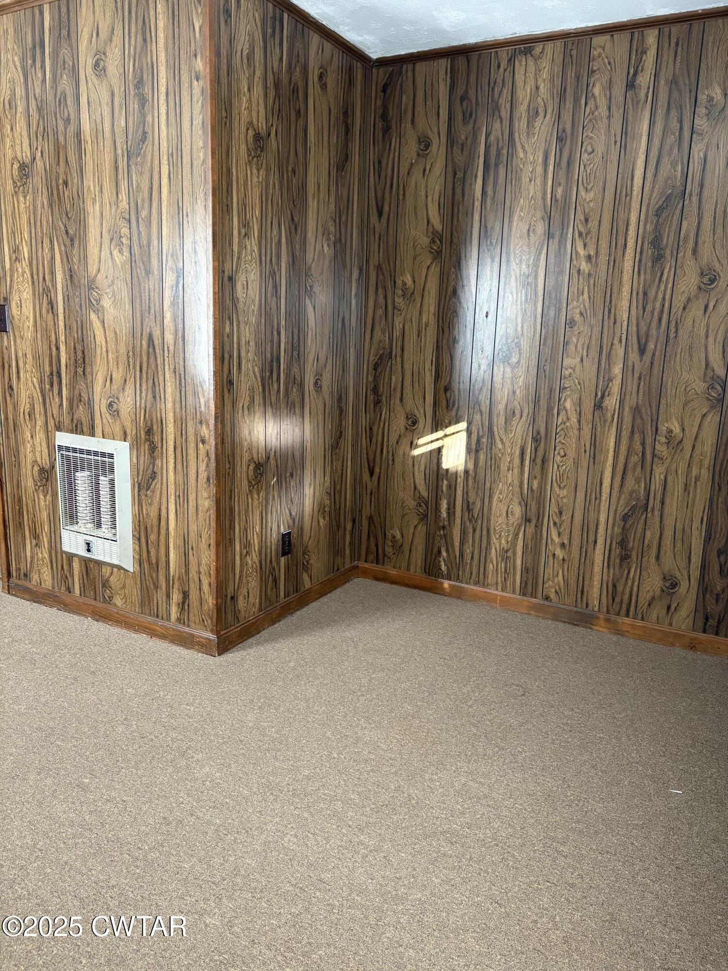 115 Jaynes Road Bells, TN 38006 - Photo 15 of 19 a view of an empty room with wooden walls