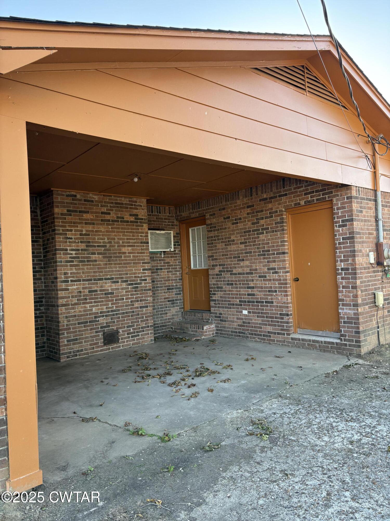 115 Jaynes Road Bells, TN 38006 - Photo 19 of 19 a view of a brick house with large windows