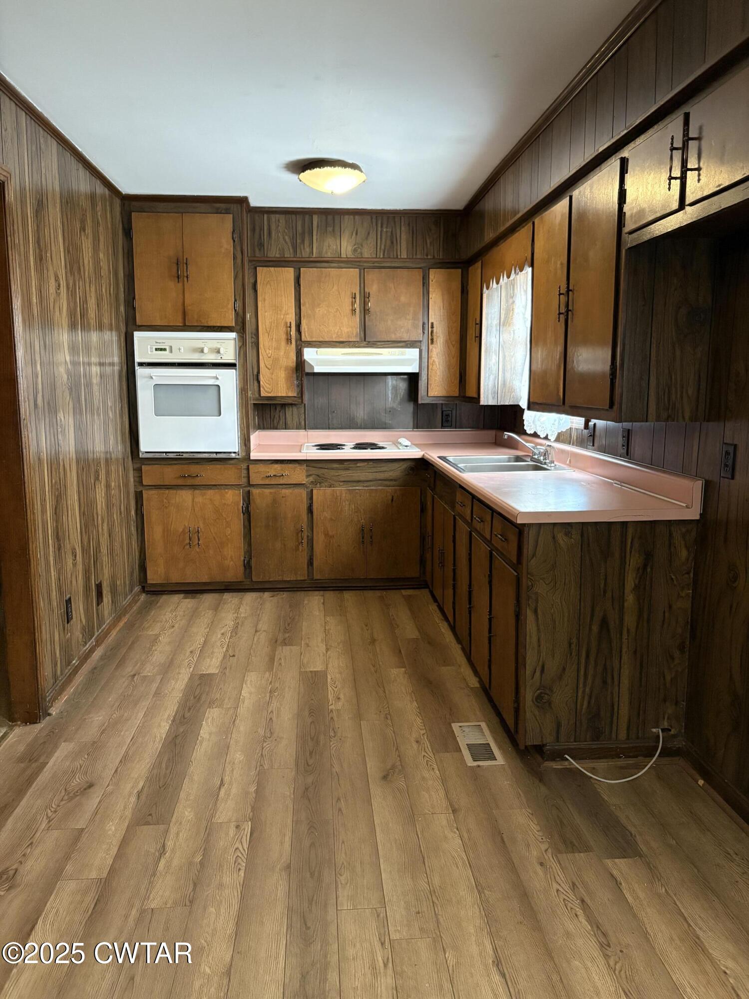 115 Jaynes Road Bells, TN 38006 - Photo 4 of 19 a kitchen with a sink stove and refrigerator