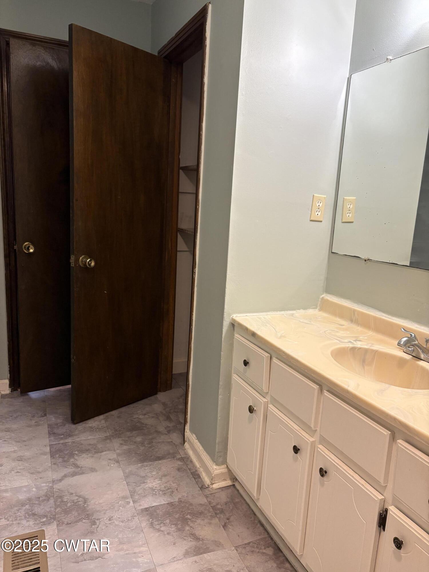 115 Jaynes Road Bells, TN 38006 - Photo 7 of 19 a bathroom with a sink and a mirror