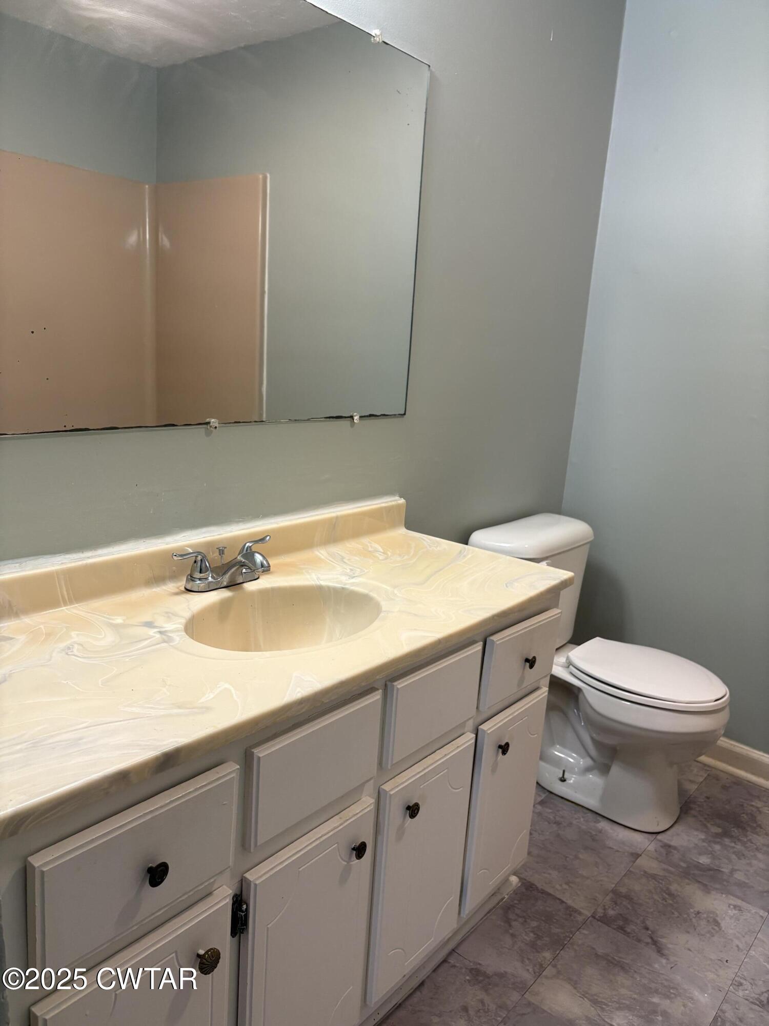 115 Jaynes Road Bells, TN 38006 - Photo 8 of 19 a bathroom with a toilet sink and mirror