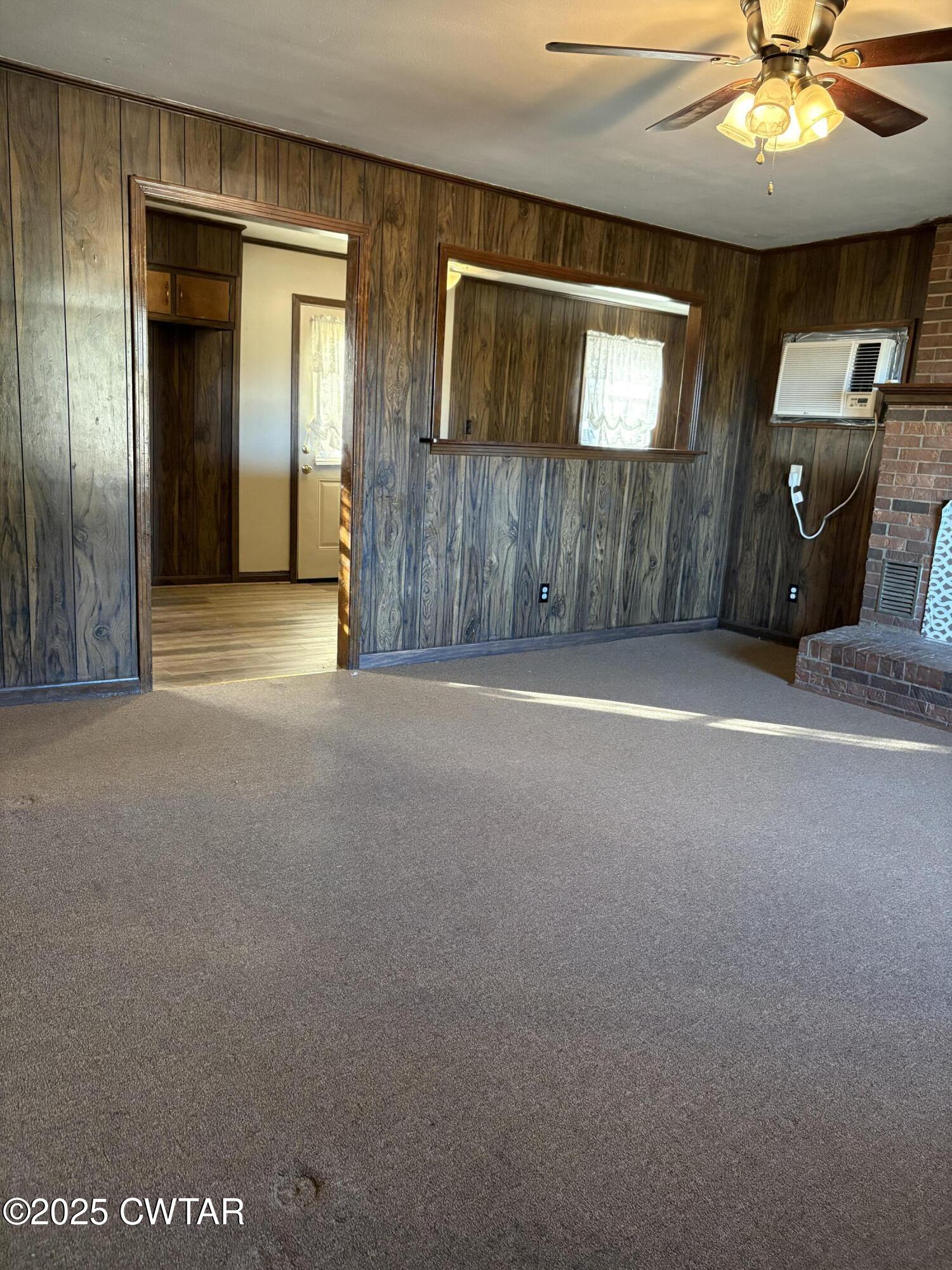 115 Jaynes Road Bells, TN 38006 - Photo 10 of 19 a view of a livingroom with a ceiling fan and a chandelier fan