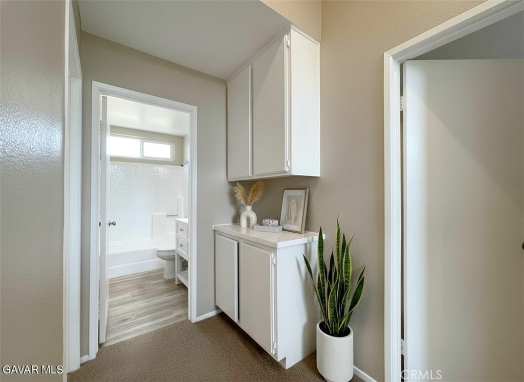 43856 Windsor Place Lancaster, CA 93536 - Photo 18 of 39 a view of a bathroom with a sink