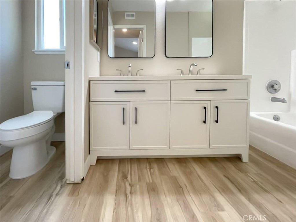 43856 Windsor Place Lancaster, CA 93536 - Photo 23 of 39 a bathroom with a sink and a mirror