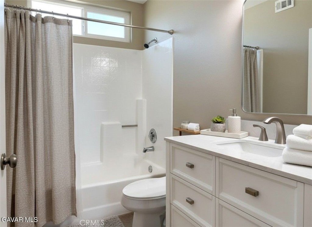 43856 Windsor Place Lancaster, CA 93536 - Photo 29 of 39 a bathroom with a sink a toilet and shower