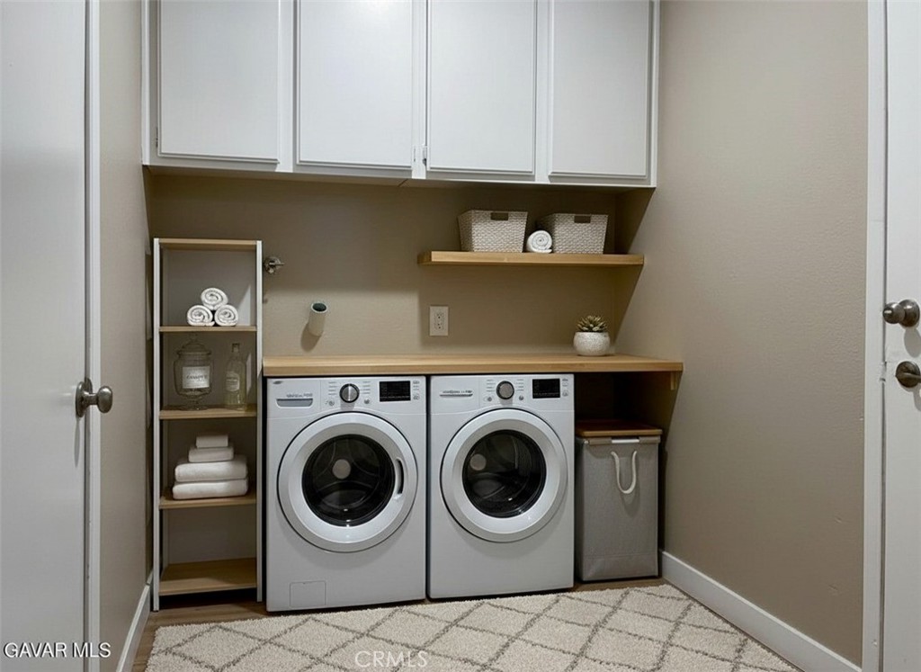 43856 Windsor Place Lancaster, CA 93536 - Photo 32 of 39 a utility room with dryer and washer