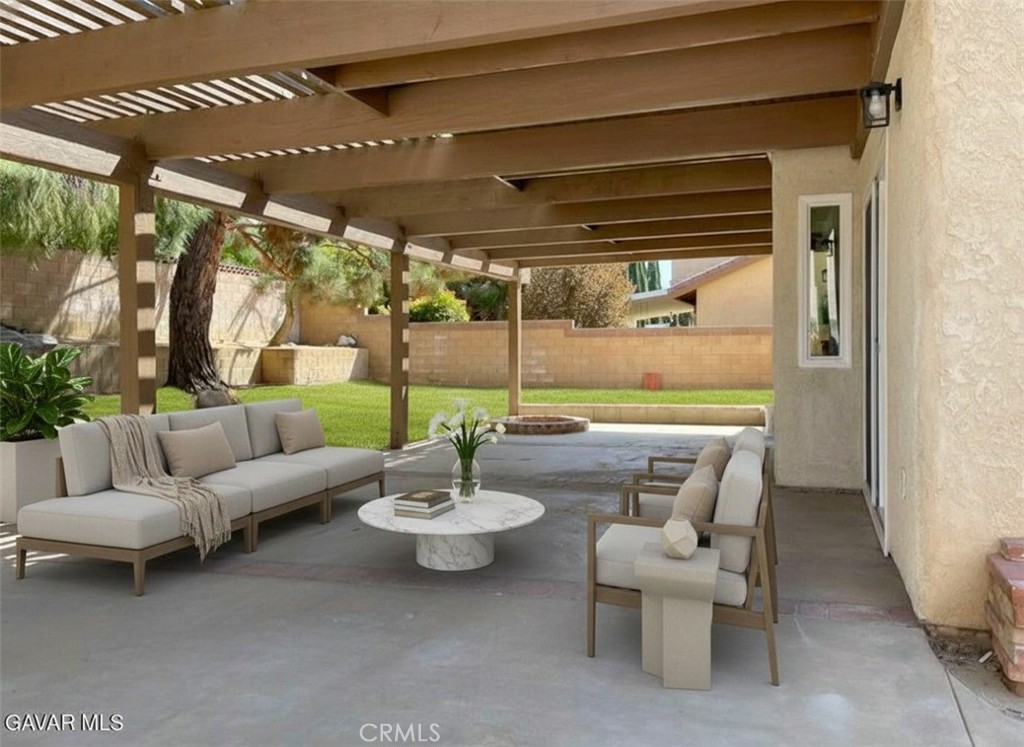 43856 Windsor Place Lancaster, CA 93536 - Photo 33 of 39 a view of a patio with a dining table and chairs with floor to ceiling window