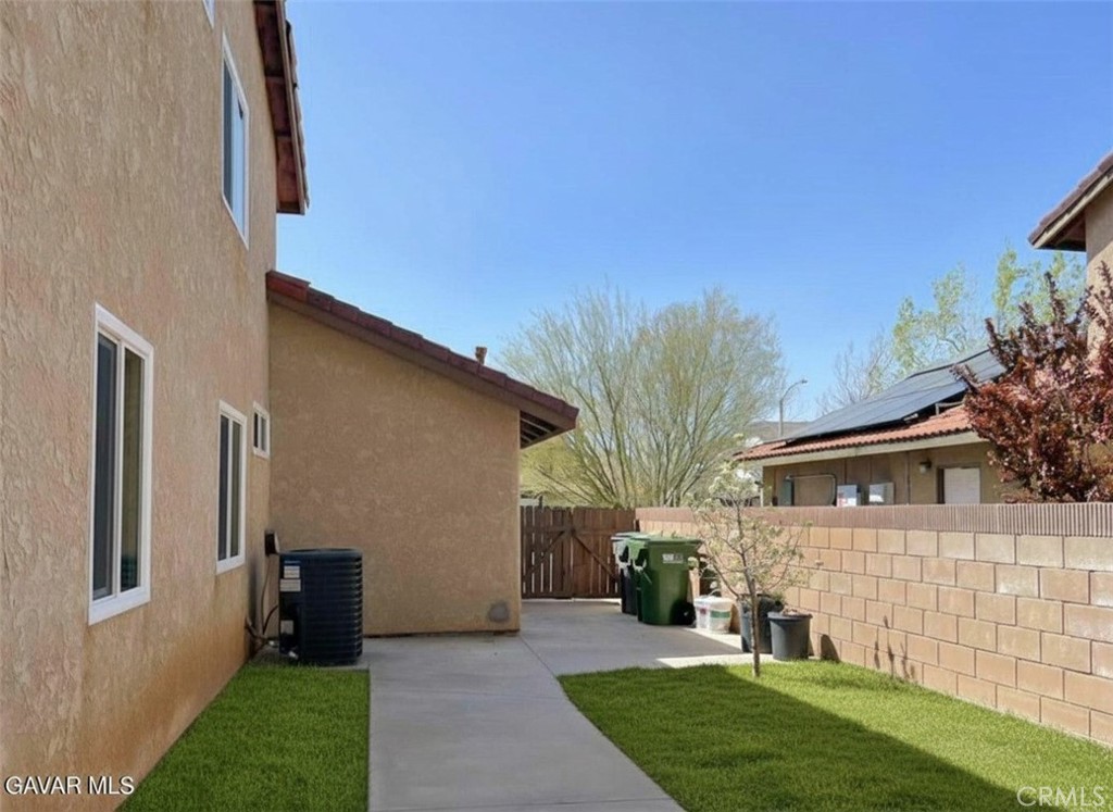 43856 Windsor Place Lancaster, CA 93536 - Photo 36 of 39 a view of a house with a yard