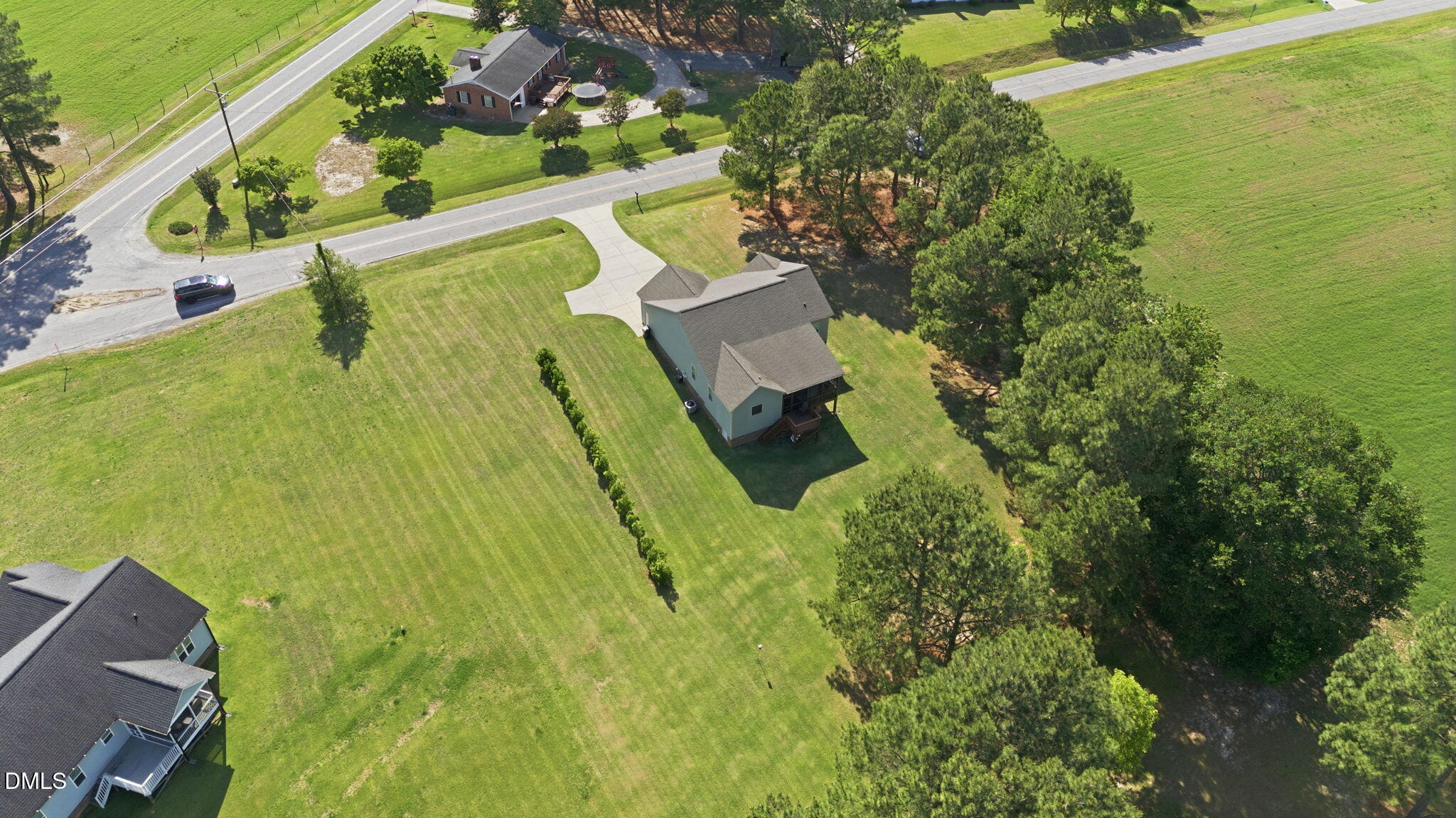 1547 Lassiter Pond Road Four Oaks, NC 27524 - Photo 38 of 45 an aerial view of a house with a yard swimming pool and outdoor seating