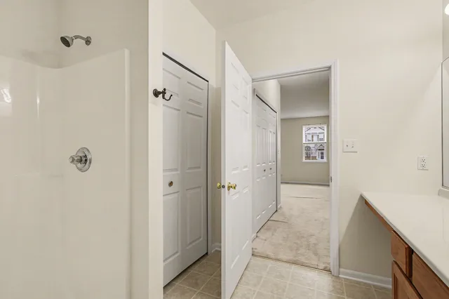 a bathroom with a shower and a sink