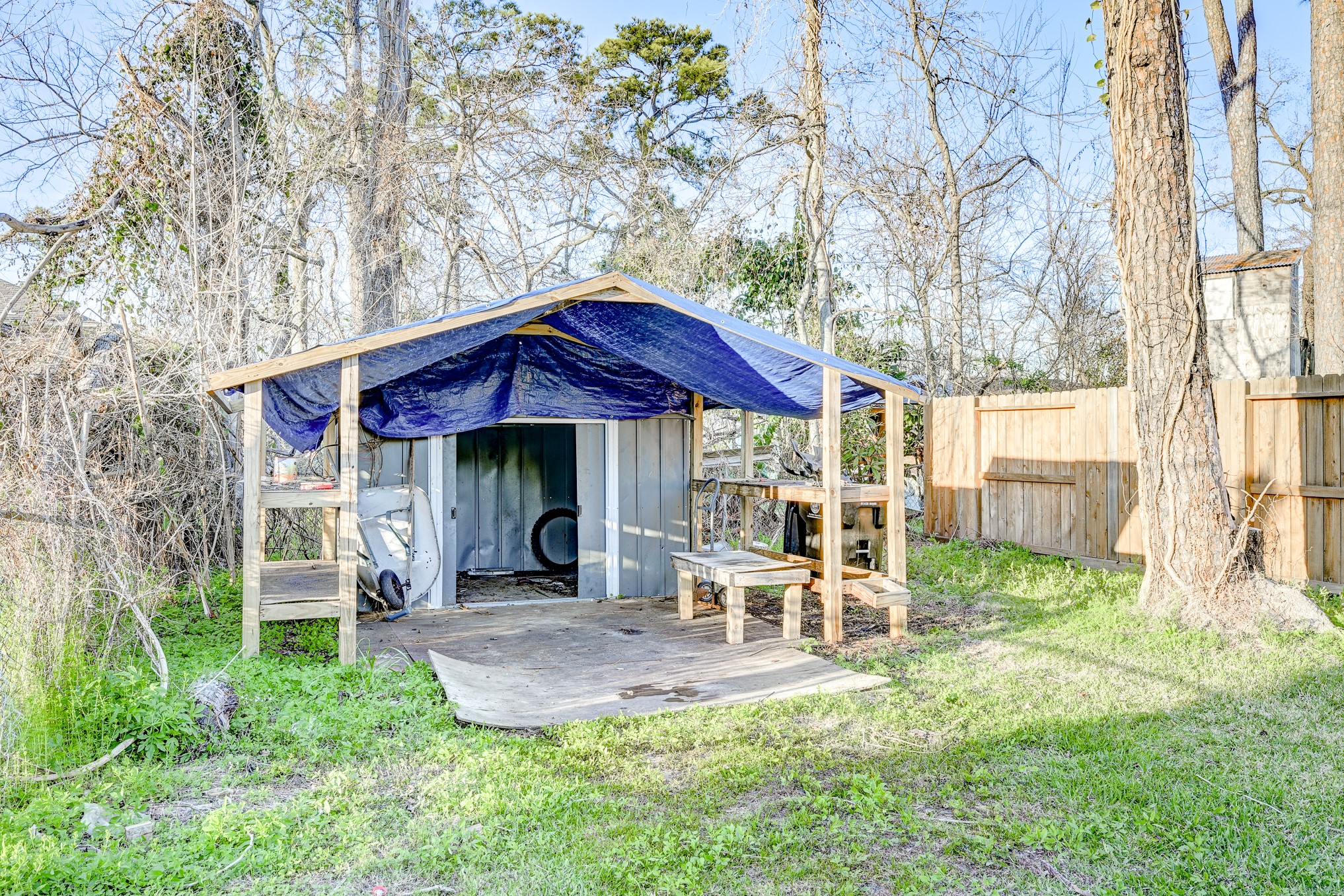 7925 Way Street, Unit A Houston, TX 77028 - Photo 26 of 29 a view of a chair and table in backyard of the house