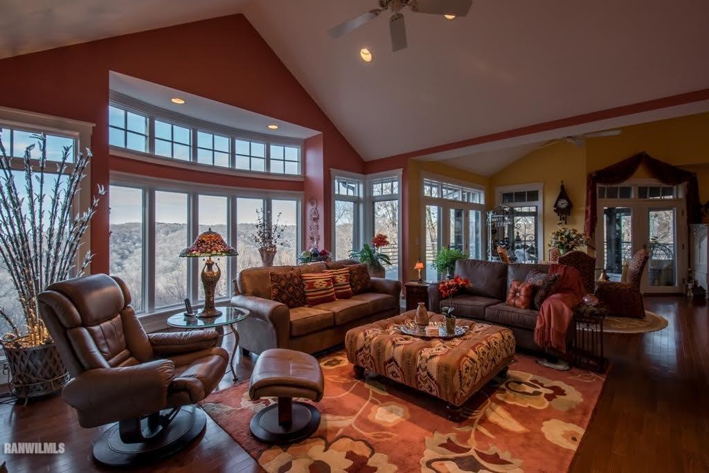 8622 Fisher Road Galena, IL 61036 - Photo 4 of 7 a living room with furniture fireplace and a large window