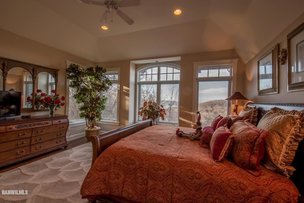 8622 Fisher Road Galena, IL 61036 - Photo 5 of 7 a bedroom with a large bed and windows