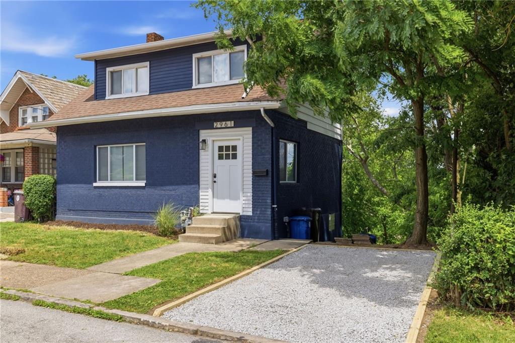 2961 Ruthwood Avenue Pittsburgh, PA 15227 - Photo 3 of 29 a front view of a house with a yard