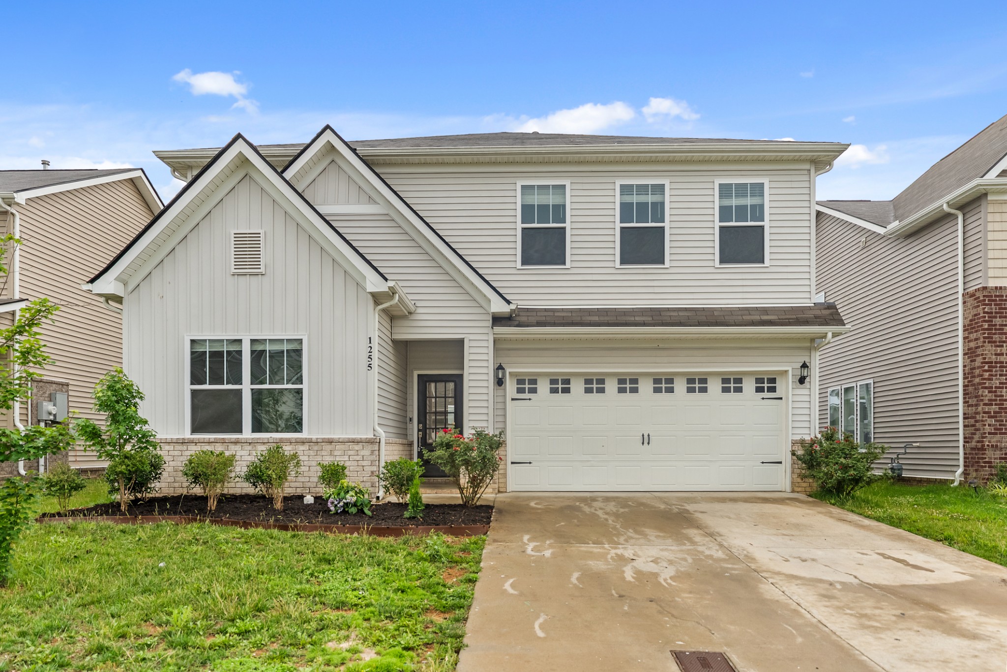 1255 Inverness Pass Lebanon, TN 37087 - Photo 5 of 40 a front view of a house with a yard and garage