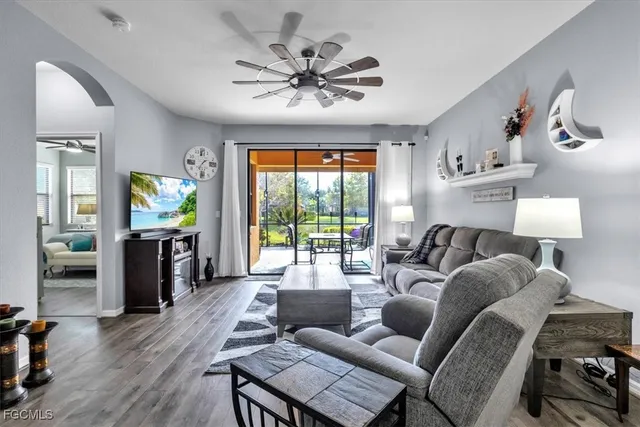 a living room with furniture and a flat screen tv