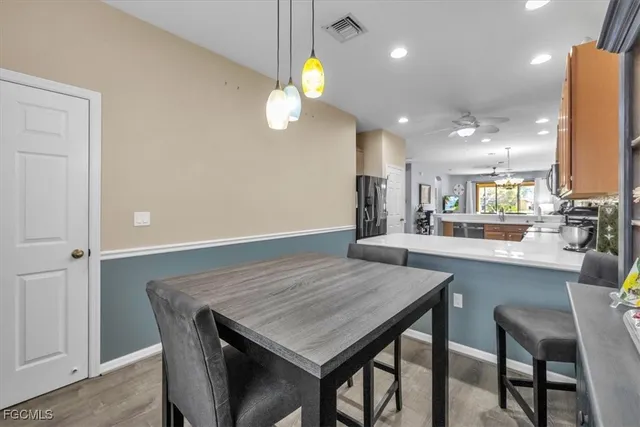 a kitchen with a table and chairs in it